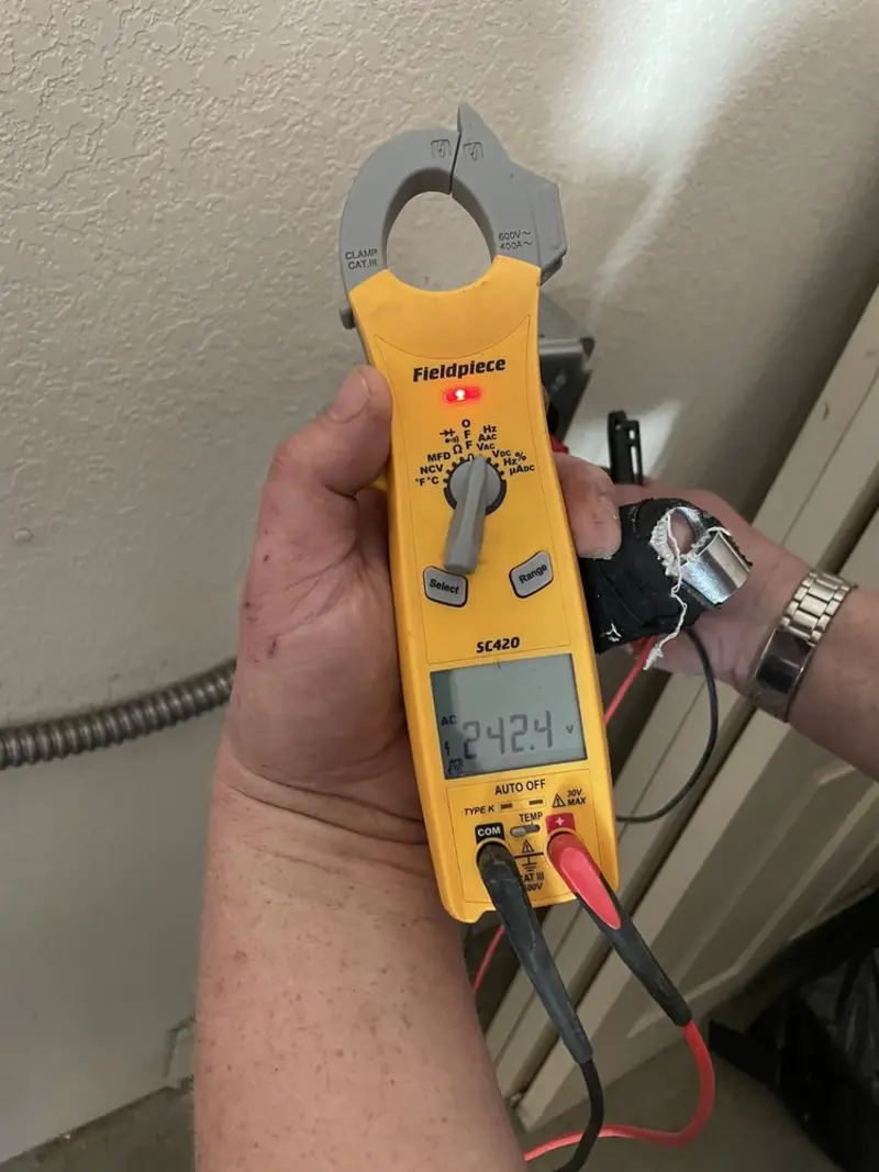 Voltage testing with clamp meter during Ceiling Fan Installation in Marianna